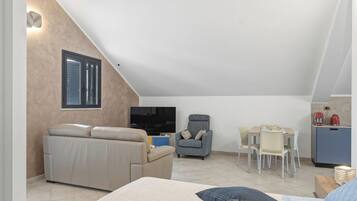 Departamento Deluxe, para no fumadores, vista al mar | Área de sala de estar