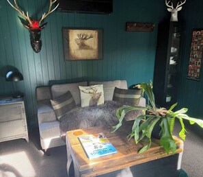 Apartment, 1 Bedroom, Smoking, Balcony | Living room | Books - The Olde Whiskey Room (Kelvin Heights)