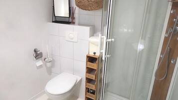 Shower, hair dryer, towels, soap