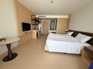 Deluxe Condo, 1 King Bed, Beach View | Desk, laptop workspace, blackout drapes, free WiFi