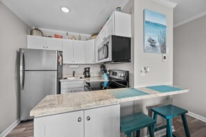 Fridge, microwave, oven, coffee/tea maker - 1st floor oceanfront point unit (North Topsail Beach)