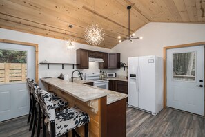 Microwave, oven, stovetop, dishwasher - Private & Modern Creekside Cabin w/ Hot Tub and Fire Pit - Great Location! (Cherry Log)