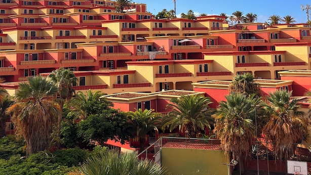 A multi-story hotel with balconies and palm trees. - Costa Adeje Sunset Ocean View Garden Studio B (Adeje)