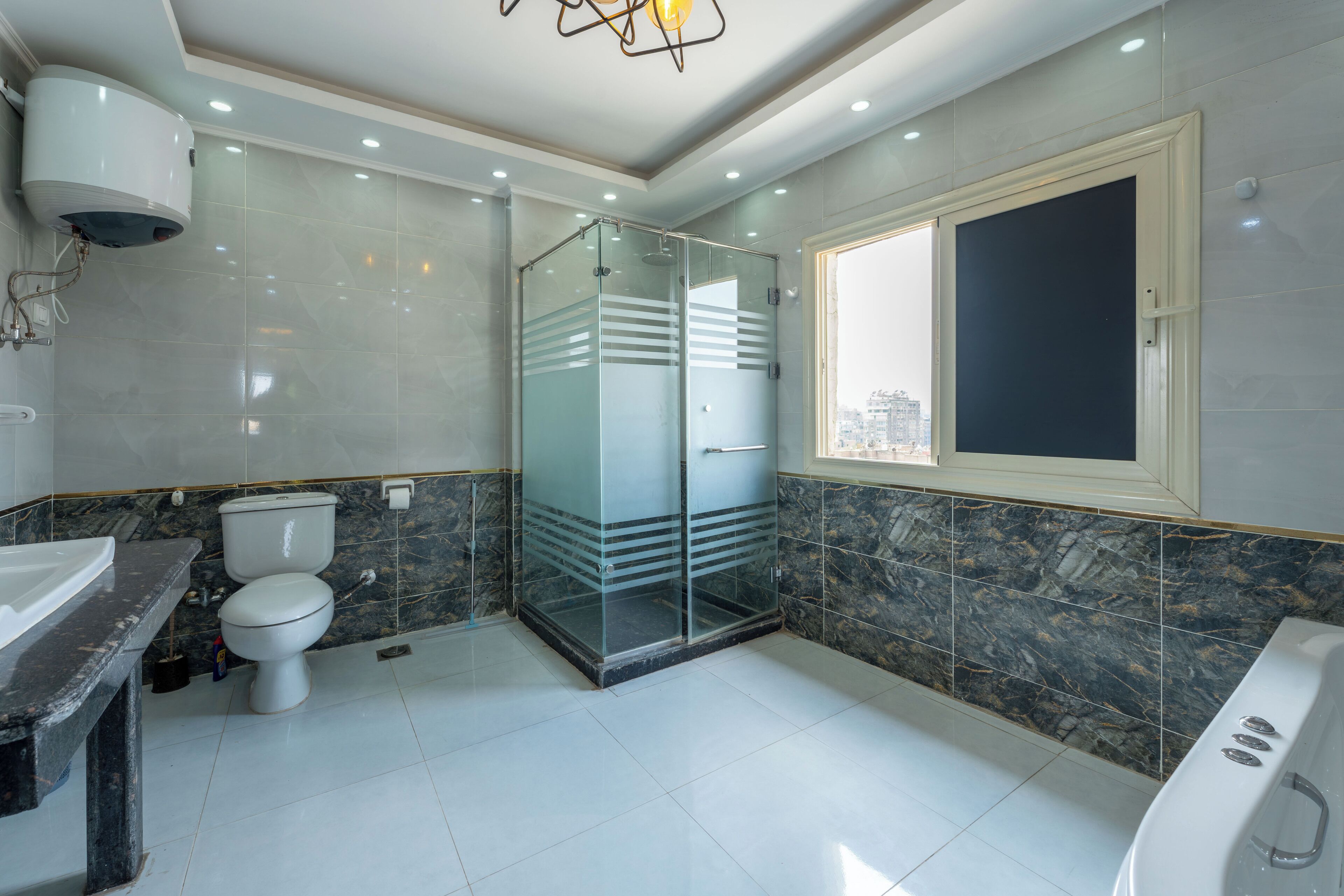 Shower, jetted bath, hair dryer, towels