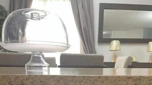 A kitchen with a granite countertop, a glass bowl, and a cabinet with a drawer. - Beautiful entire house near Alameda, Saltillo (Saltillo)