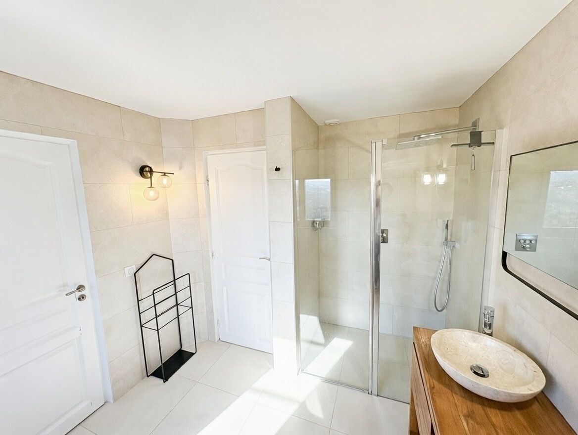 Shower, hair dryer, soap, toilet paper