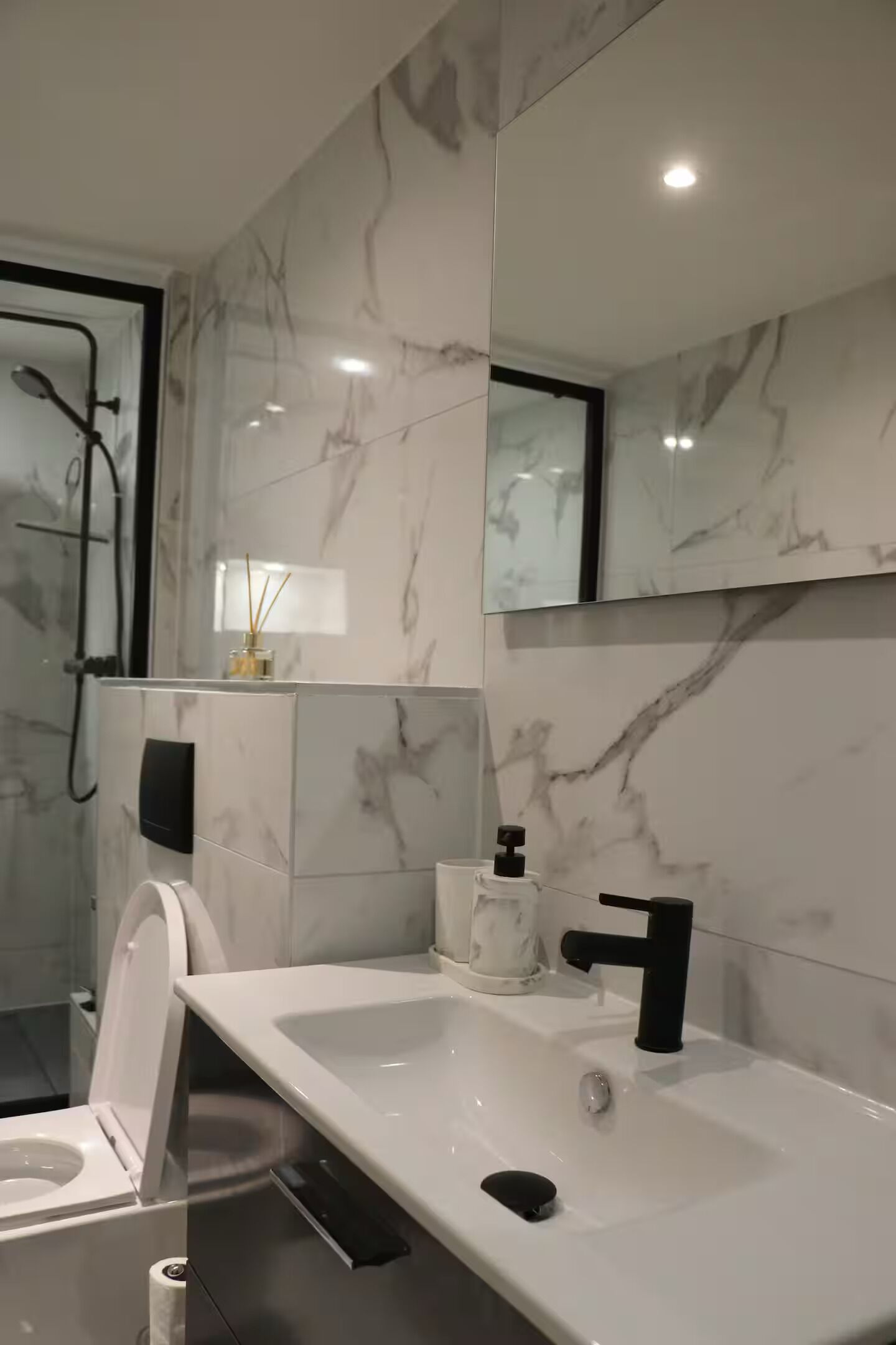 Shower, hair dryer, towels, toilet paper