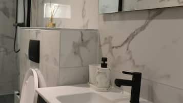Shower, hair dryer, towels, toilet paper