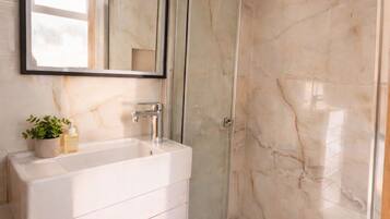 Shower, eco-friendly toiletries, hair dryer, towels