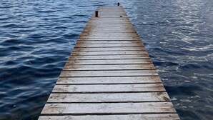 A wooden pier extending into calm waters under a partly cloudy sky. - The balconies of Bouzigues l'hippocampe (Bouzigues)