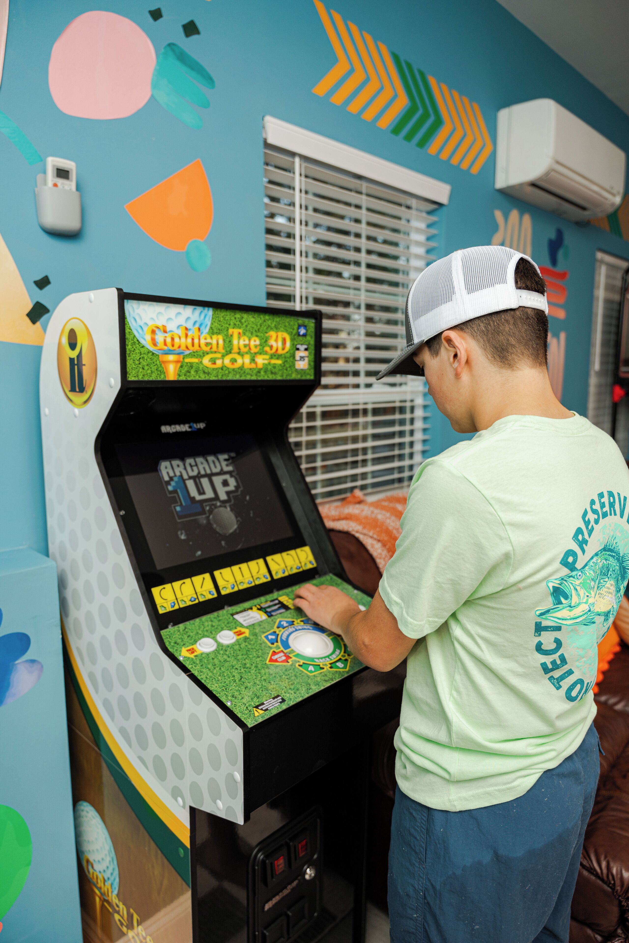 A person playing a golf video game on a console.
