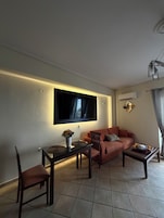 Quarto casal superior, vista para a praia | Área de estar