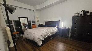 A bedroom with a large bed, a dresser, a nightstand, a chair, and a desk. - Unique One Bedroom with VIP Terrace in Yonge & Eglinton and 5 minutes to Subway (Toronto)