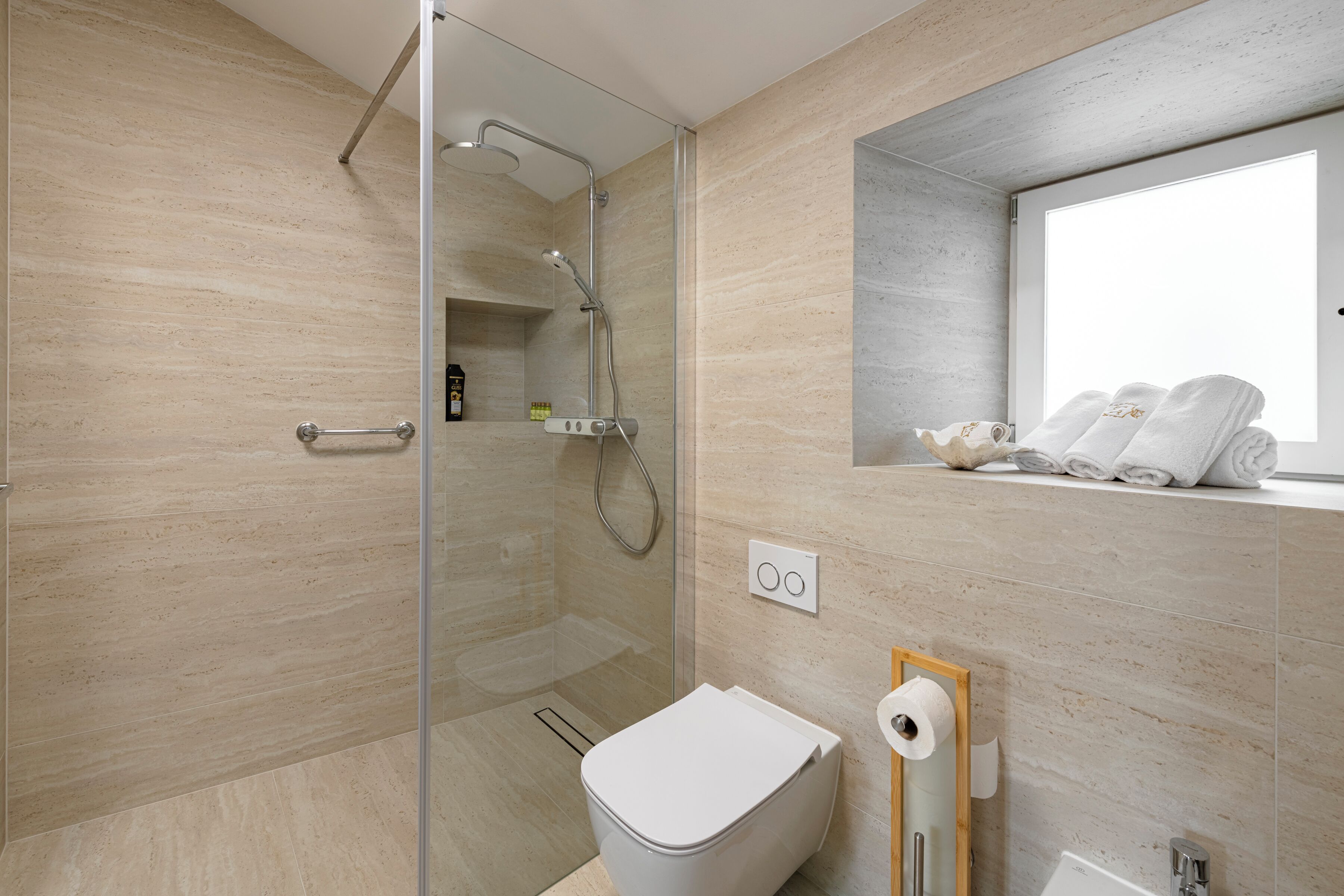 Hair dryer, bidet, towels, soap