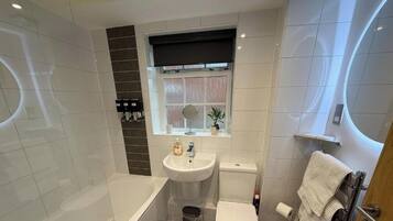 Hair dryer, towels, soap, shampoo