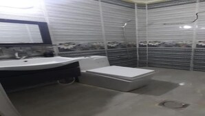 A bathroom with a sink, toilet, and shower. - Homey Apt in Jerash w/ City-View. Explore Jerash Ruins from this Spacious Apt (Jerash)