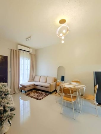 Living area. 2 BR fully Air-conditioned aesthetic staycation, Entire home in Mati, Ph.