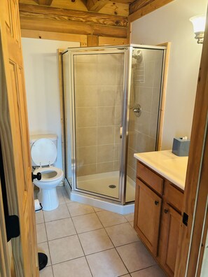 Shower, towels, soap, toilet paper
