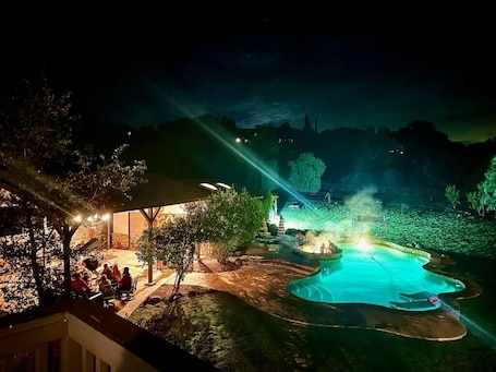 Pool. Winnebago camper set up on beautiful property with resort style pool and jacuzzi