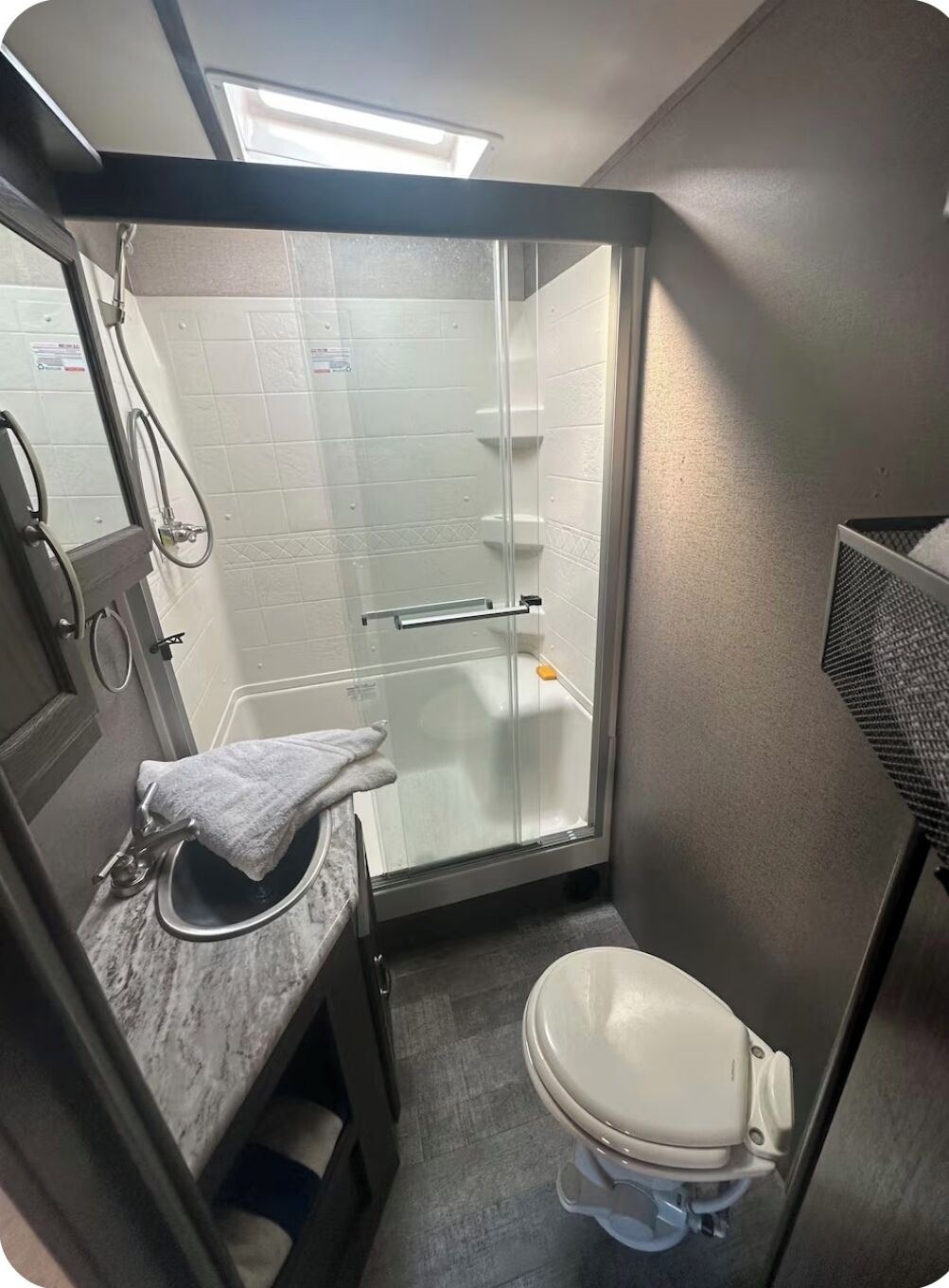 Shower, towels, soap, toilet paper