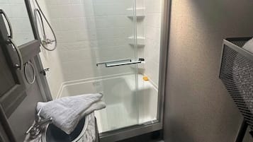 Shower, towels, soap, toilet paper