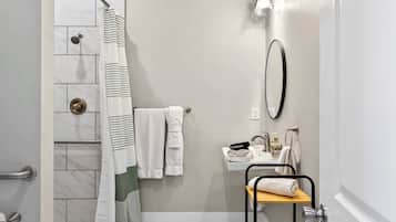 Shower, hair dryer, towels, shampoo
