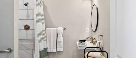 Shower, hair dryer, towels, shampoo