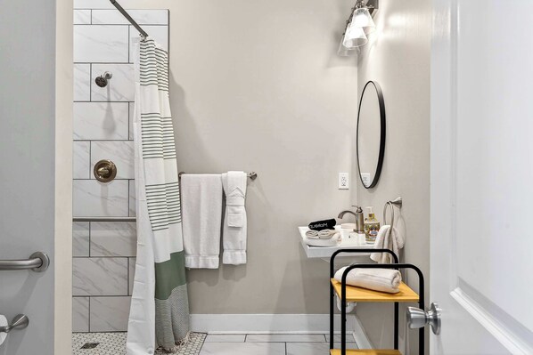 Shower, hair dryer, towels, shampoo