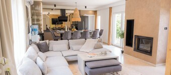 Luxurious riverside retreat with pool, sauna, jacuzzi, and panoramic nature views.