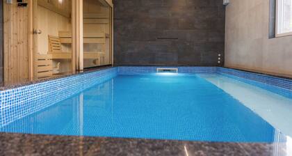 Luxurious riverside retreat with pool, sauna, jacuzzi, and panoramic nature views.
