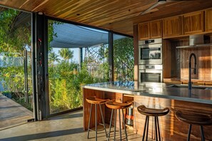 Fridge, microwave, oven, stovetop - Villa Okeanos - Modern Chic Waterfront Villa with Pool (Placencia)