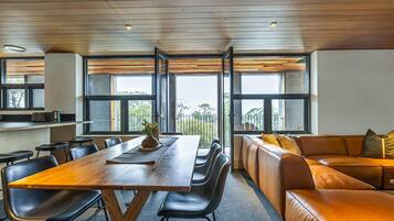 Deluxe Apartment, Balcony, Mountain View | Living area | 32-inch flat-screen TV with digital channels