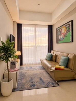 Apartment, 3 Bedrooms, City View | Living area | 43-inch Smart TV with cable channels - Teras By SanLiving - 3BR - Hublife Mall (Jakarta)