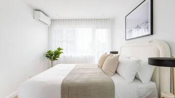 Two Bedroom Deluxe Apartment | Desk, laptop workspace, iron/ironing board, cribs/infant beds