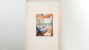 A room with a wooden deck, a sofa, and a view of the ocean. - 5 Min to Crown & NGV | Stylish 2BR | City View (Southbank)