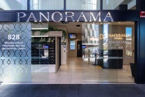 The exterior of a hotel named "Panorama" with a modern design, located at 828 Whitehorse Road. - Puddings Home Box Hill Stylish 2BR Mountain View Gym (Box Hill)