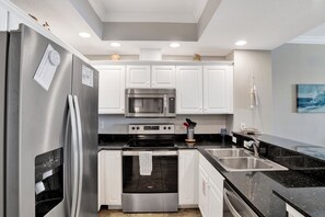 Fridge, microwave, oven, stovetop - Crystal Shores - Beachfront 2BR, Gulf Front Views, Indoor/Outdoor Pool, Hot Tub (Gulf Shores)