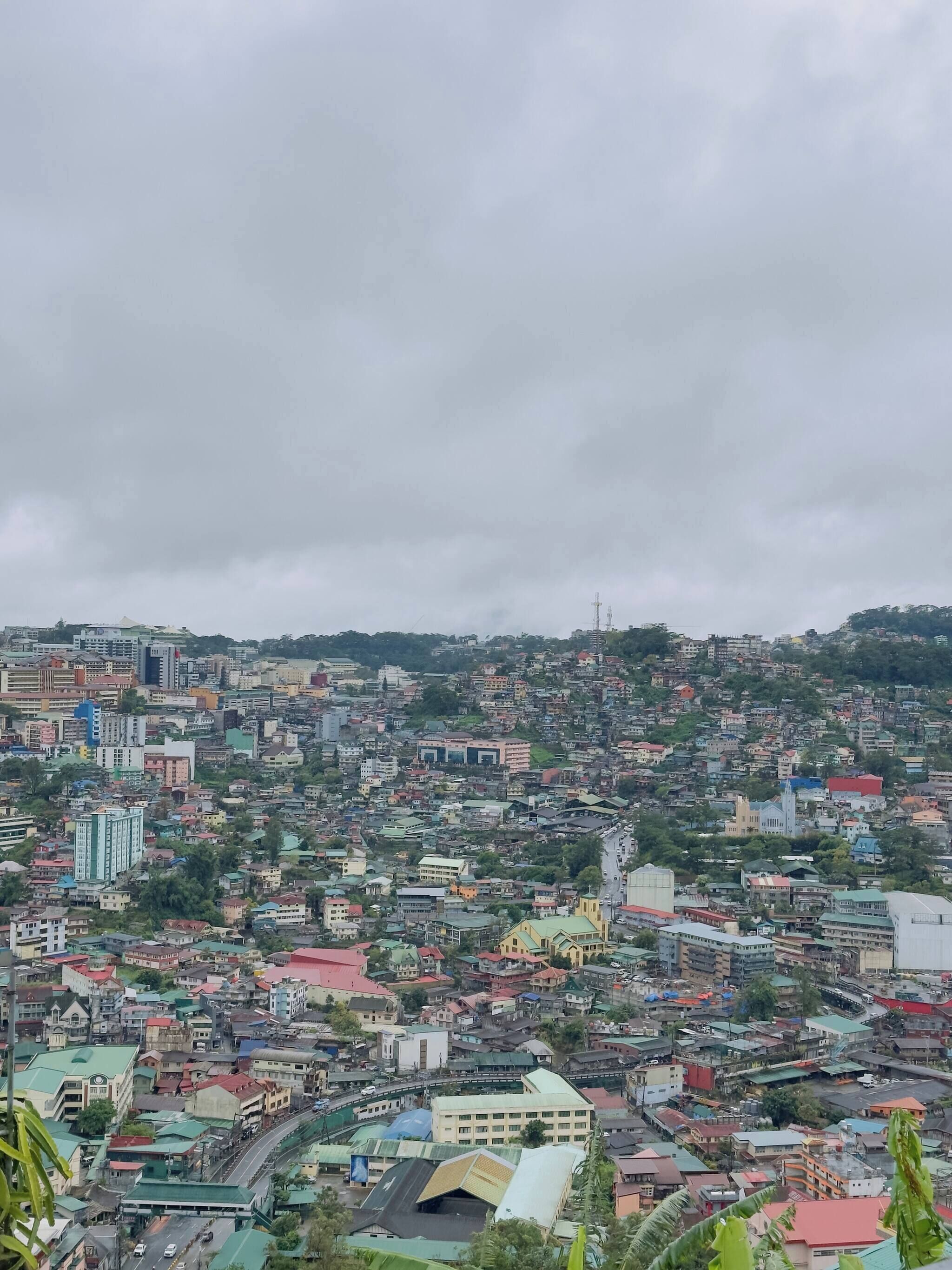 A densely packed urban area with various buildings, including residential and commercial structures.