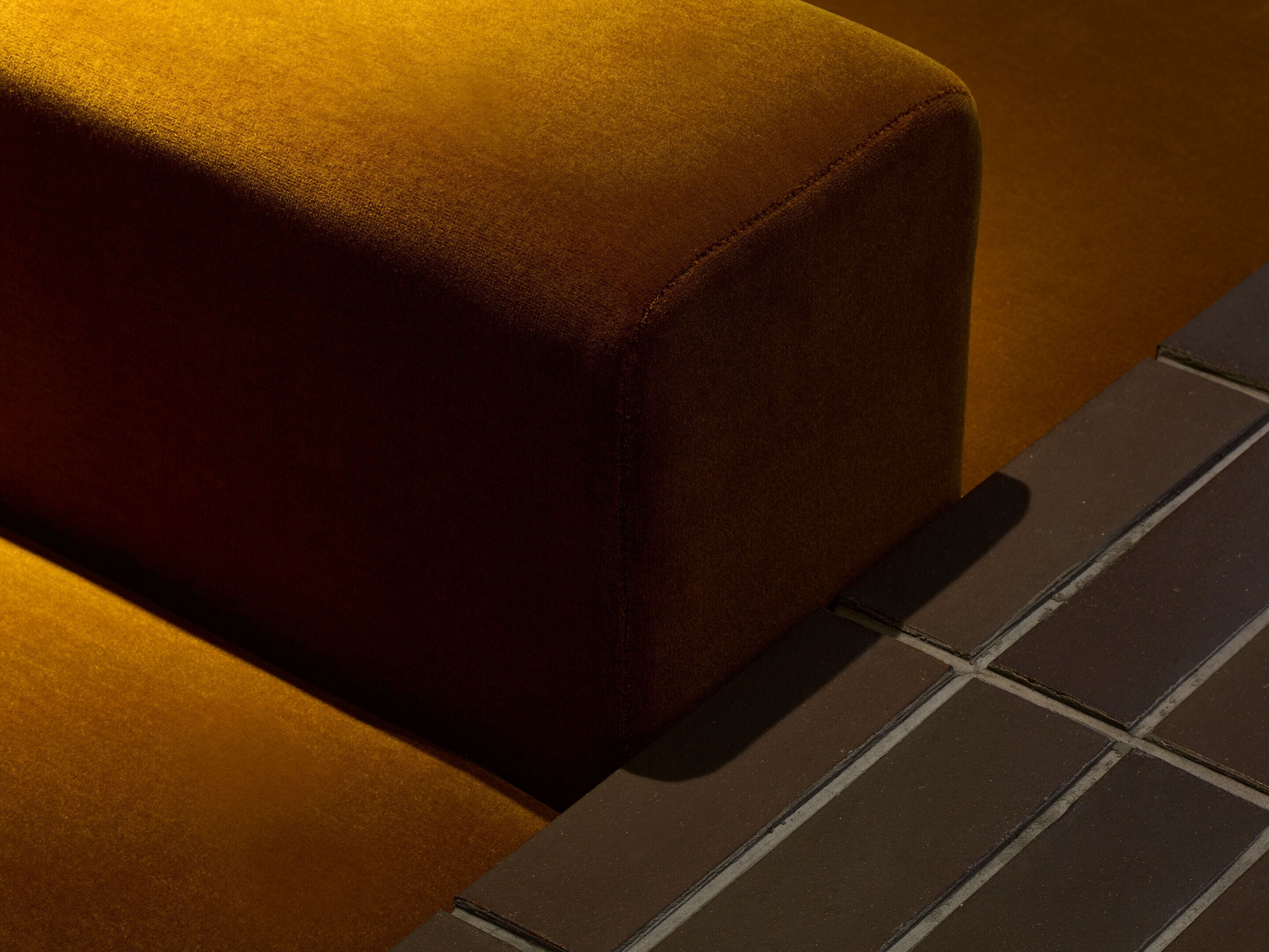 A close-up of a textured surface with a dark, rectangular object adjacent to it.