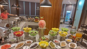 A buffet setup with various food items and a beverage station. - Taj Al- Wajh hotel   (Al Wajh)