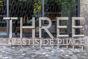 A sign with the words 'THREE WESTSIDE PLACE' in large, capital letters. - Designer CBD Suite. Gym, Heated Pool, Sauna, Steam, Opposite Southern Cross (Melbourne)