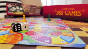 A board game with dice and a colorful game board. - Vee’s Studio Airbnb in mtwapa (Mtwapa)