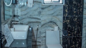 A bathroom with a marble sink, a toilet, and a shower area. - Spacious Junior Suite near UN Nairobi, Cozy Stead Haven House (Nairobi)