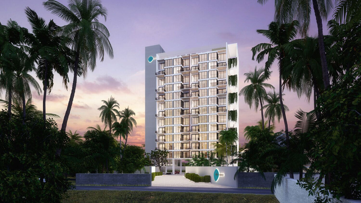 A modern multi-story hotel with a grid-like facade, surrounded by palm trees and greenery.