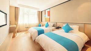 A hotel room with two beds, a desk, and a large window with curtains. - BOOEIN HOTEL (Suzhou)