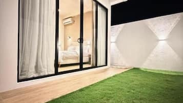 Quarto casal luxo, vista para o jardim