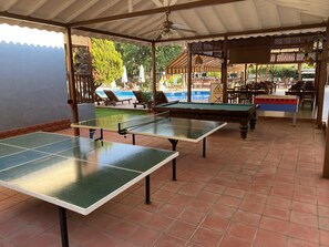 An outdoor area with two ping pong tables, a foosball table, and a pool table. - Hotel Oludeniz Double Room (Ölüdeniz)