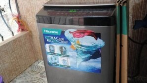 A Hisense washing machine with a label indicating it is an 'Extra Care Extra Clean' model. - Dandy Home, 2 BdRm, Estn Bypass Kamakis Greenspot (Ruiru)