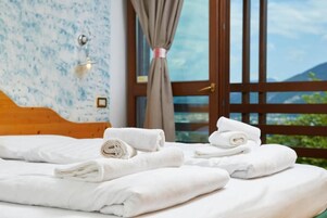 Triple Room, Balcony, Mountain View | Blackout drapes, iron/ironing board, free WiFi