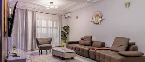 Deluxe Apartment, Balcony | Living area